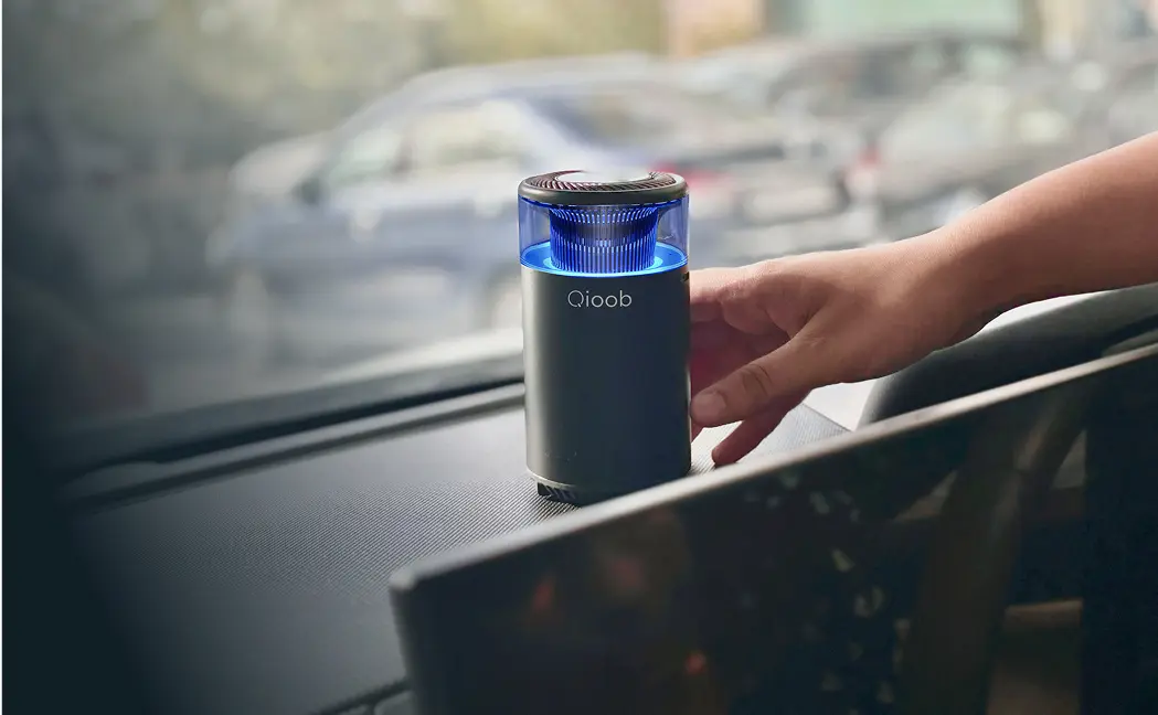 Car perfume placed on the car deck and ambient light is on